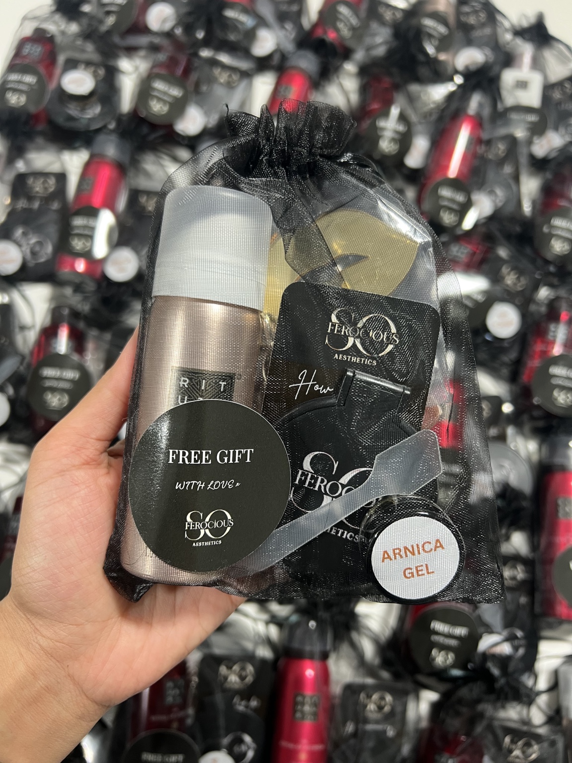 Christmas 2025 after-care kit in a black gift bag